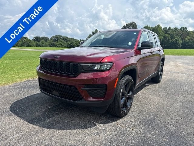 2024 Jeep Grand Cherokee Altitude in Burgandy — front three-quarter view