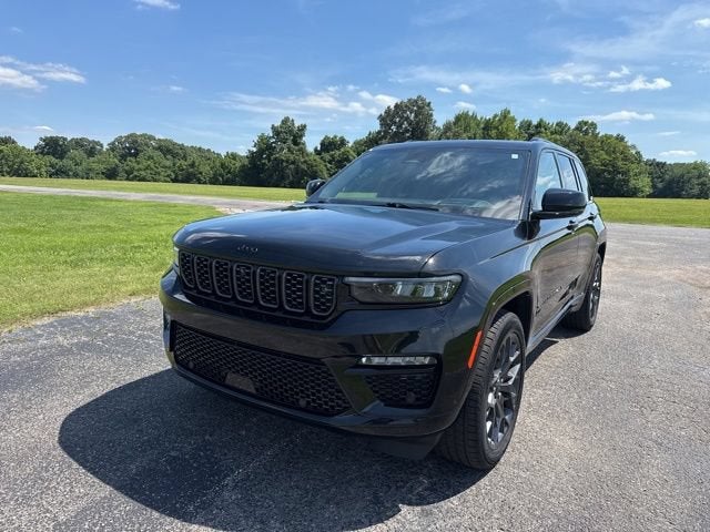 2024 Jeep Grand Cherokee Summit in Black — front three-quarter view