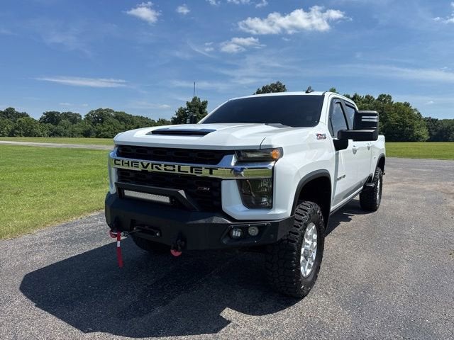 2023 Chevrolet Silverado 2500 HD LT in Summit White — front three-quarter view