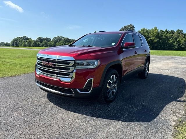 2023 GMC Acadia SLT in Volcanic Red Tintcoat — front three-quarter view