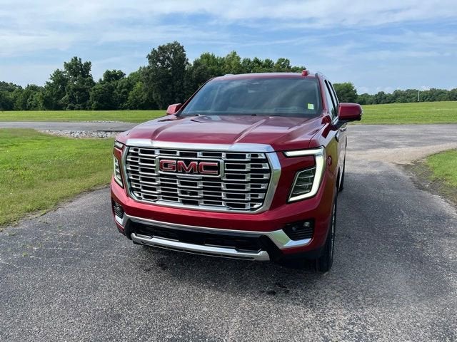 2026 GMC Yukon Denali in Volcanic Red Tintcoat — front three-quarter view